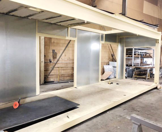 A room with walls and floors being built.